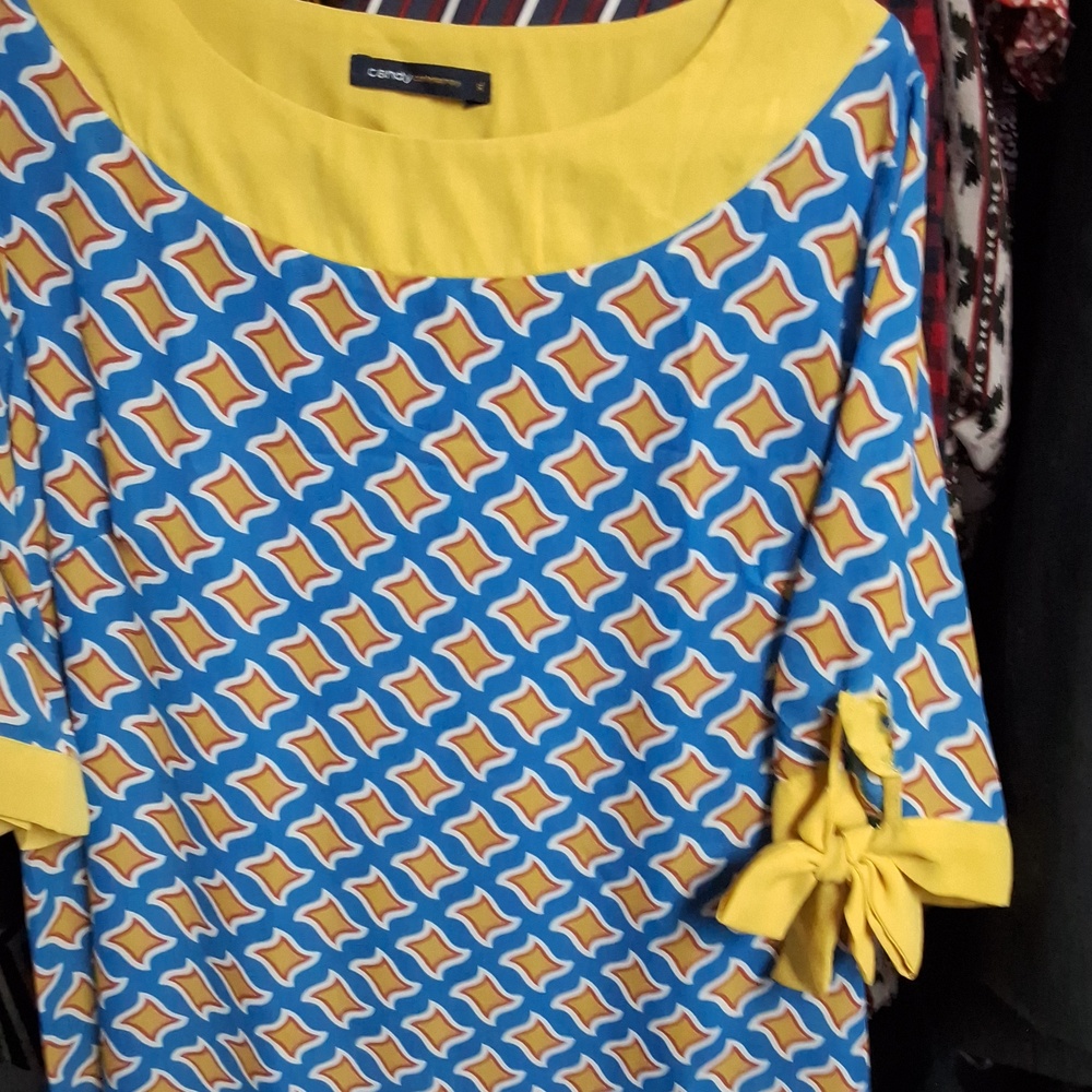 CANDY CONTEMPORARY ( as is) call- out on left sleeve -bow)